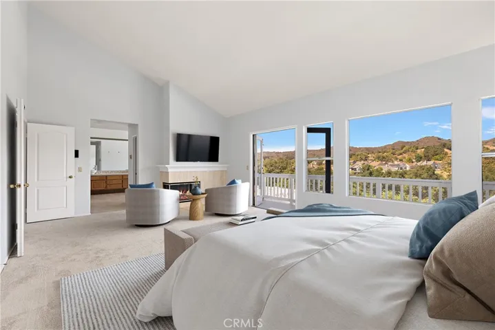 Primary suite boast stunning balcony views of golf course and community