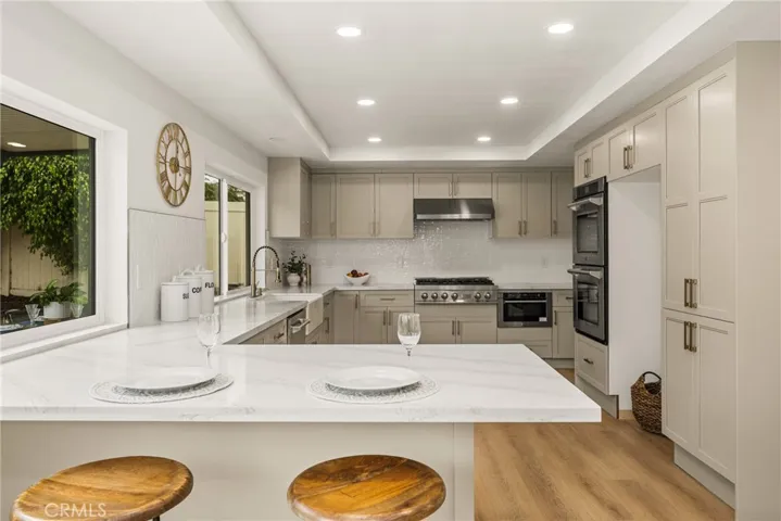 You can have up to five stools around this peninsula for sitting.