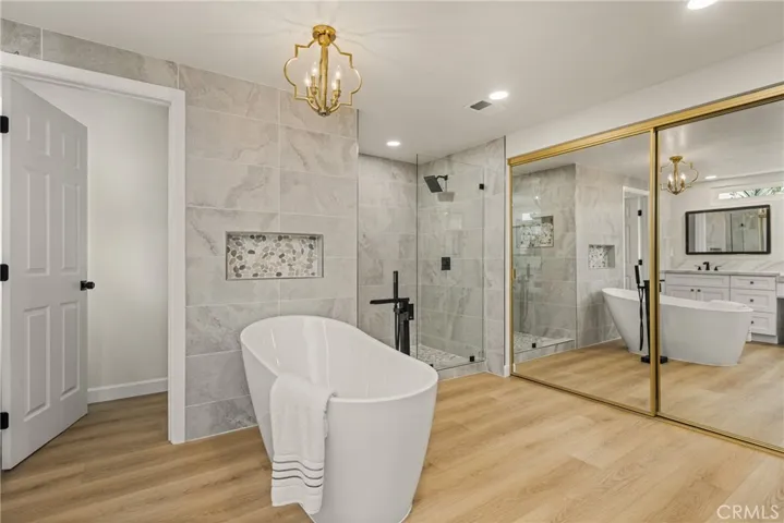 Love this primary bathroom! stand alone bathtub, large separate shower, two large closets, and a separate water closet.