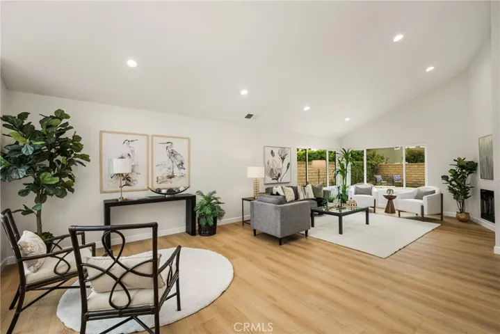 Large formal living room with fireplace and high ceilings