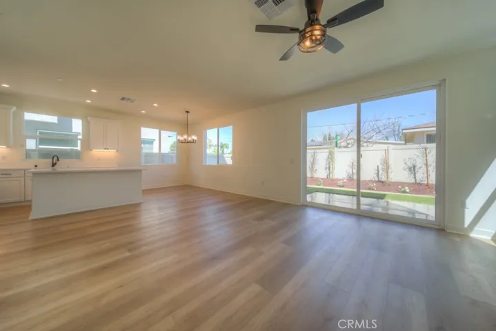 Spacious great room with 8’ sliding glass door to the private backyard.