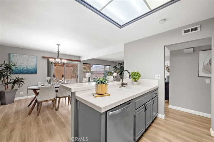 Kitchen, Dining Room, Living Room all with Views of Private Patio