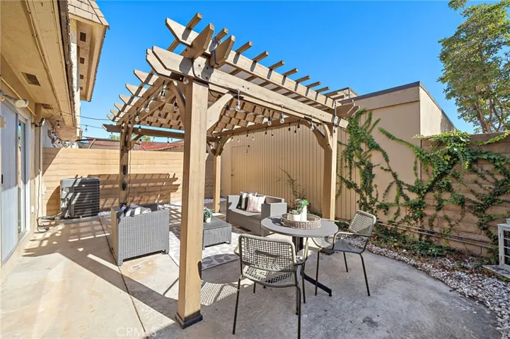 Large Private Patio with Patio Cover, Block Wall Fencing and Direct Access to 2 Car Garage