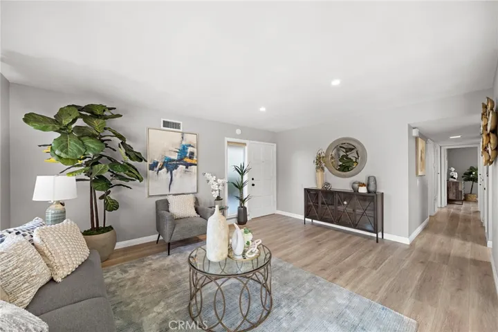 Living Room - Recessed Lighting, Designer Paint, Luxury Wood Vinyl Flooring, Dual Pane Windows