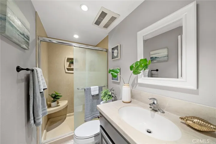 New shower door will be installed within 7 days Primary Bathroom with Recessed Lighting and Walk-In Shower with Sitting Bench