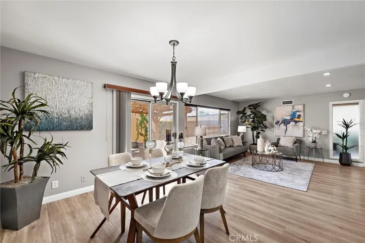 Dining Room and Living Room with Windows and Sliders Overlooking the Large Patio