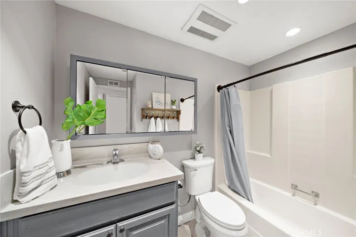Guest Bathroom has Recessed Lighting and a Tub/Shower Combo