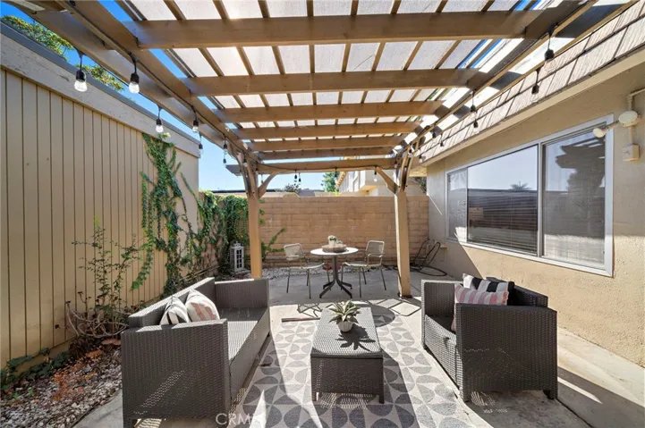 Large Private Patio with Patio Cover, Block Wall Fencing and Direct Access to 2 Car Garage