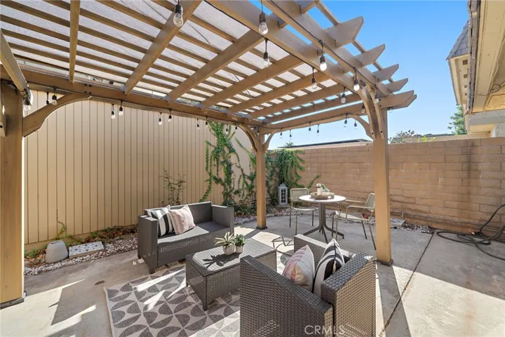 Large Private Patio with Patio Cover, Block Wall Fencing and Direct Access to 2 Car Garage