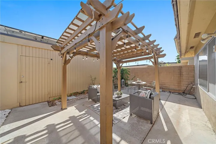 Large Private Patio with Patio Cover, Block Wall Fencing and Direct Access to 2 Car Garage