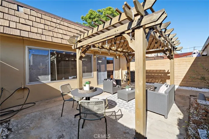 Large Private Patio with Patio Cover, Block Wall Fencing and Direct Access to 2 Car Garage