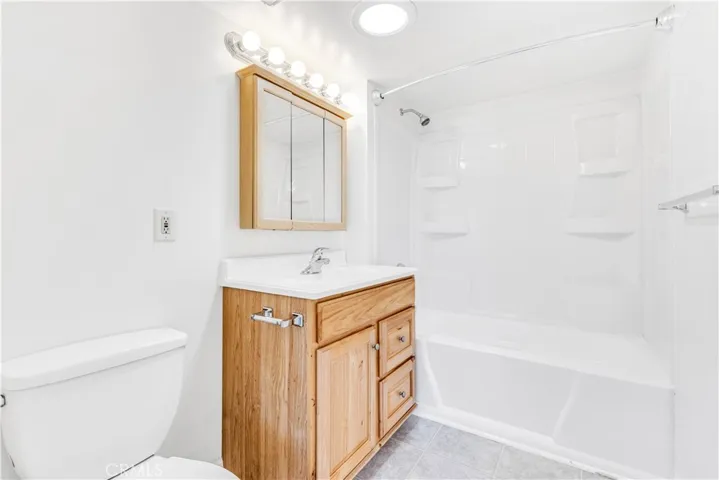 Remodeled bathroom with tub and shower.