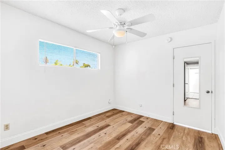 Bedroom with ceiling fan.