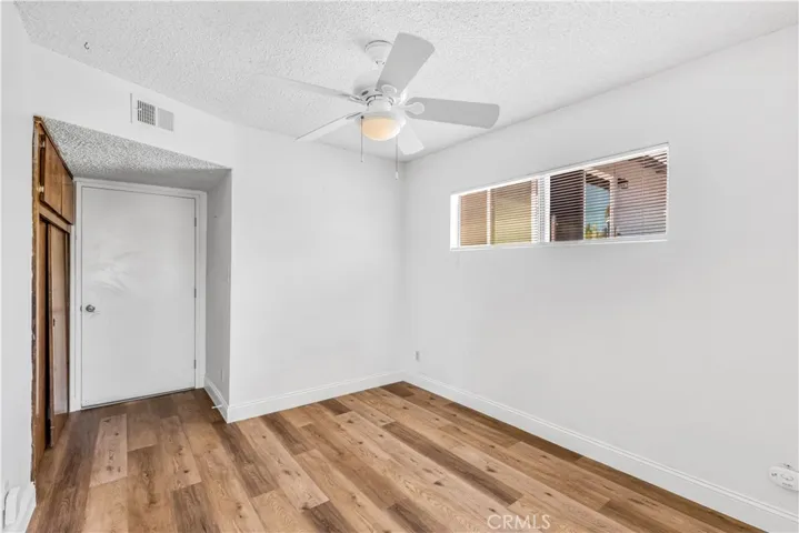 Bedroom with ceiling fan.