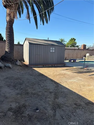 Newer storage shed in backyard
