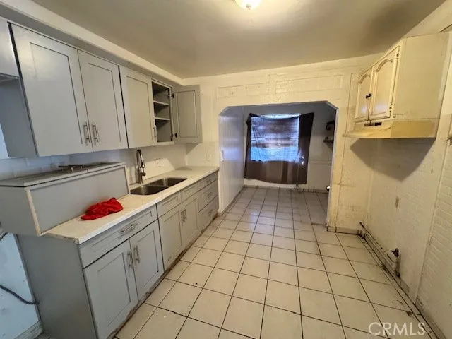 Kitchen and laundry area, unstaged
