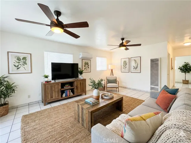 Front vacant unit livingroom, virtually staged