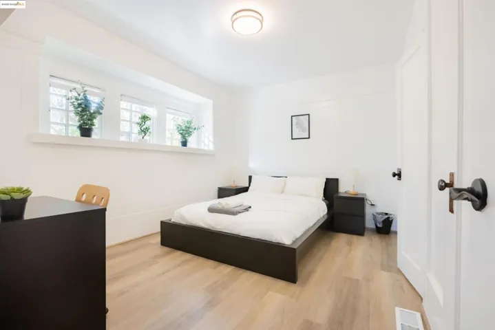 Bedroom with wood finished floors