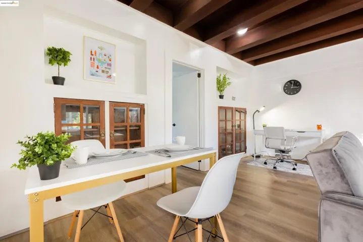 Office area featuring wood finished floors and beamed ceiling