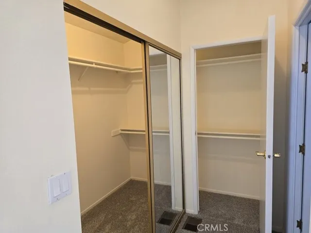 walk in closet in master, with a second entrance