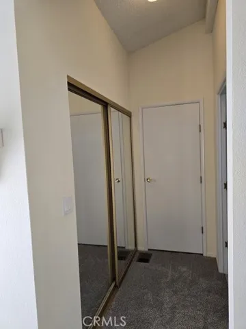 mirrored closet doors in master across from bathroom