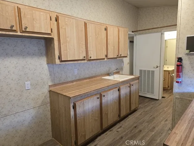 Laundry room, lots of storage, room for a second refrigerator or freezer