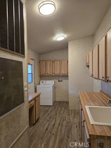 vanity in laundry room and sink, chaulk board too.