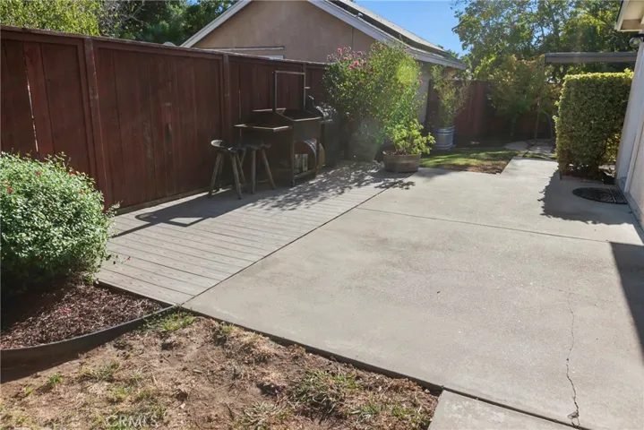 The side yard is perfect for more outdoor living.