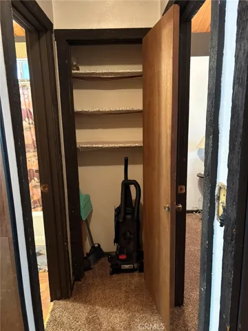 Hallway with closet for storage