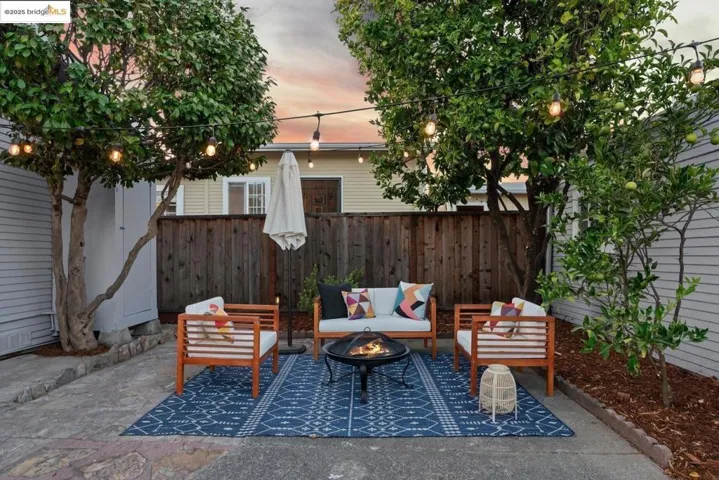 View of patio / terrace with an outdoor living space with a fire pit