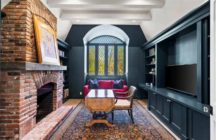 Wood panel office with wood burning fireplace