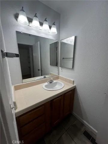Bathroom with nice sized vanity with medicine cabinet.