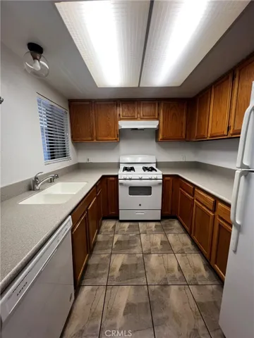 Kitchen includes a window for natural light, gas stove, refrigerator and dishwasher included.