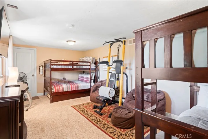 Additional room set up as bunk room/gym.