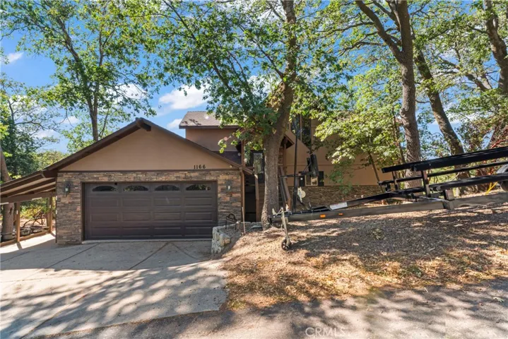 Garage with boat parking to the right.