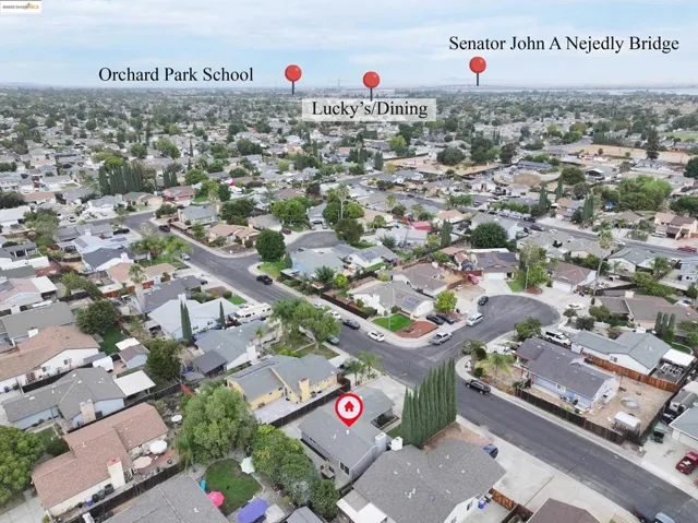 Aerial overview of property's location featuring nearby suburban area