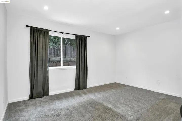 Spare room with carpet and recessed lighting