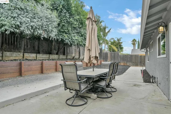 Fenced backyard featuring outdoor dining area and a patio area
