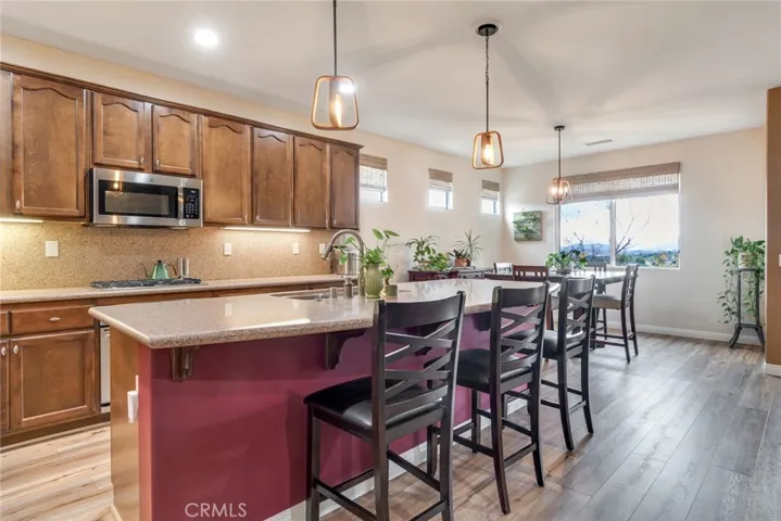 Giant Center Island Between Kitchen and Great Room; Dining Elle Has Window Views