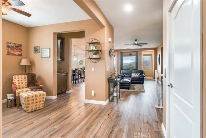 View From Elevator Doorway Into Den & Hallway Toward Great Room. Note Acoustic Beautiful Upgraded Flooring.
