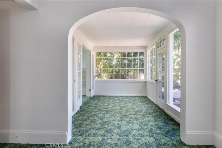 Enclosed porch at the back of the house.