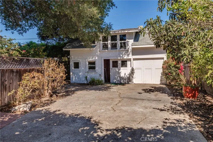 Carriage house.  Two-car garage with workshop to the left.  Upstairs is a small 1 bedroom; 1 bath apartment.  This building is in need of repairs.