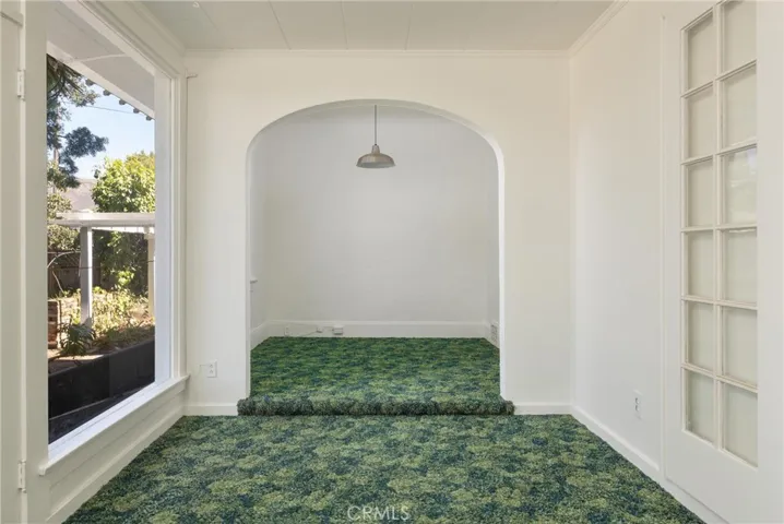 Bonus room/office off enclosed back porch.