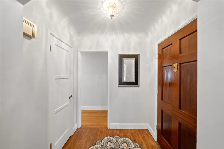 Beautiful entry with the coffered ceiling and brilliant lighting