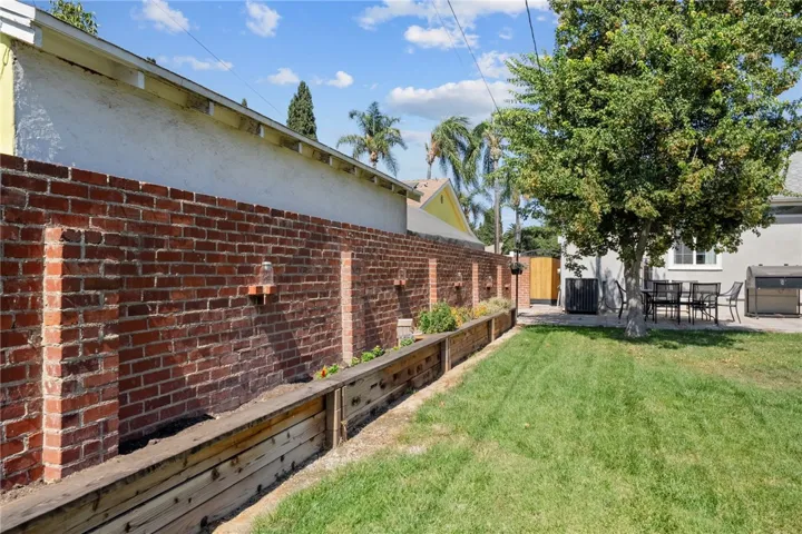 Love the brick fence on this side of the yard