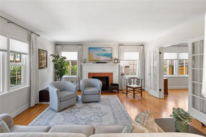 Check out that gorgeous living room with fireplace.  Lots of natural light!