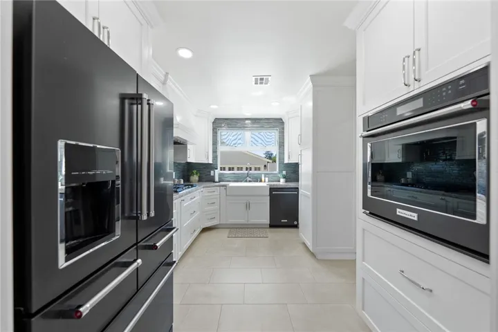 Kitchen-Aide appliances stay, including the refrigerator.
