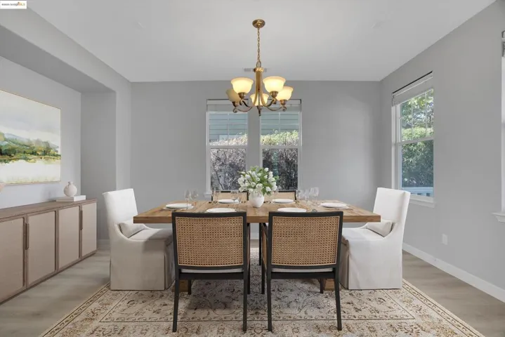 Dining room featuring light wood-style floors and a chandelier