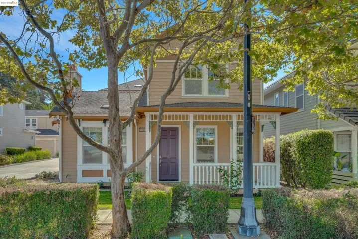 View of front of home with covered porch and a shingled roof
