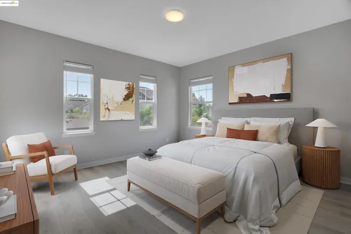 Bedroom featuring wood finished floors and baseboards